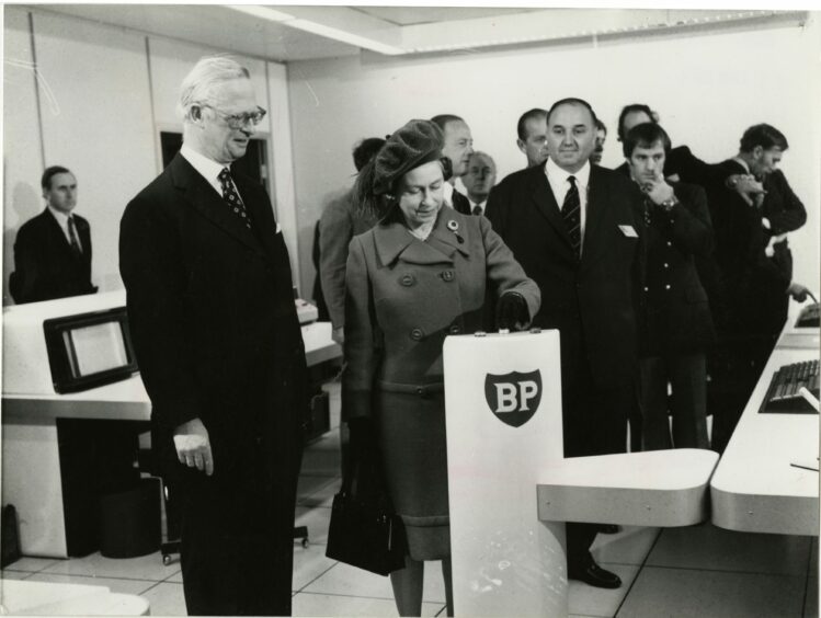 The Queen switches on the first flow of oil from the North Sea at the inauguration of the BP Forties field at BP's headquarters, Dyce.