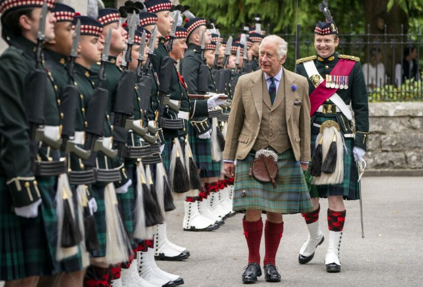 King Charles III inspects Balaklava Company, 5th Battalion, The Royal Regiment of Scotland, at the gates of Balmoral, as he takes up summer residence at the castle. The ceremony took place on Monday, August 21.