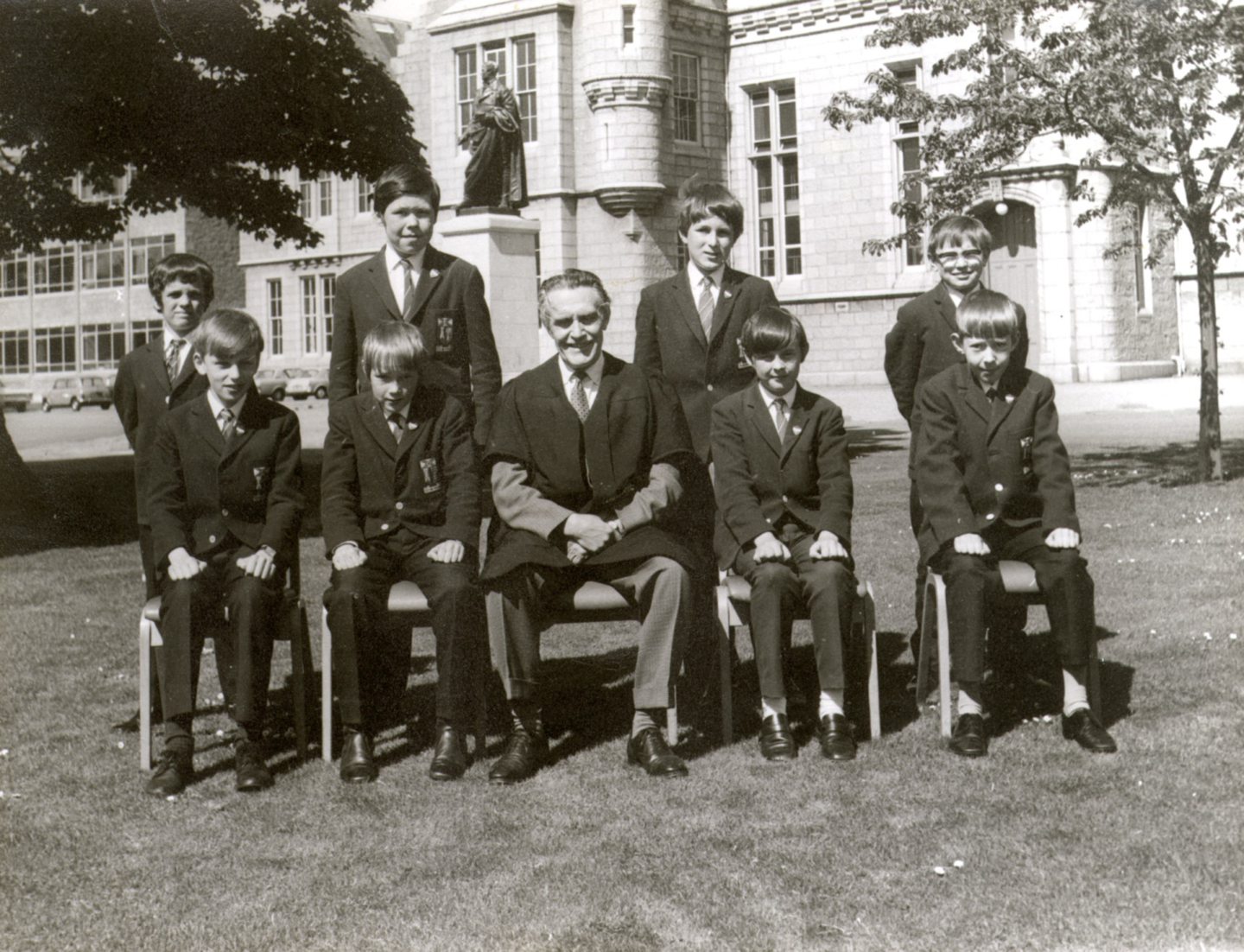 Aberdeen Grammar Lower School monitors line up with rector John Skinner for this 1971 photograph.
