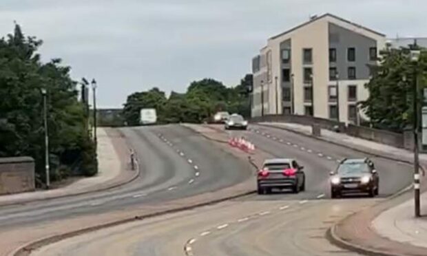 Video footage of a car driving into oncoming traffic on the A82 Friars Bridge has surfaced online.