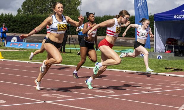Jane Davidson wins the Scottish 100m final. Aberdeen club-mate Rebecca Matheson is on the far side. Image: Bobby Gavin/Scottishathletics.