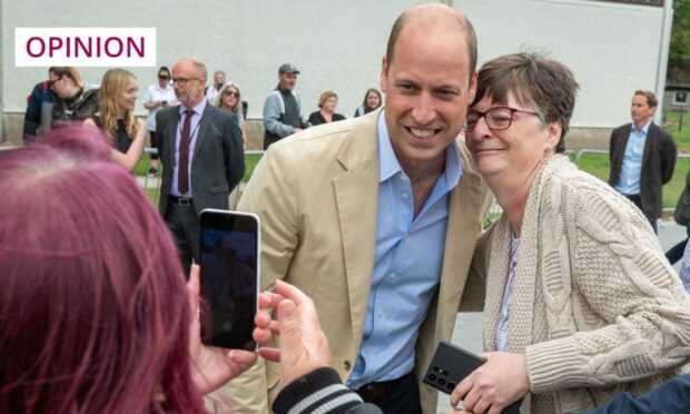 Prince William poses for photos with members of the public while on a tour of the Tillydrone Community Campus in Aberdeen during June (Image: Kenny Elrick/DC Thomson)