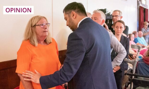 First Minister Humza Yousaf with protester Theresa Mallett, who interrupted his speech at the recent SNP independence convention at Caird Hall in Dundee (Image: Jane Barlow/PA Wire)