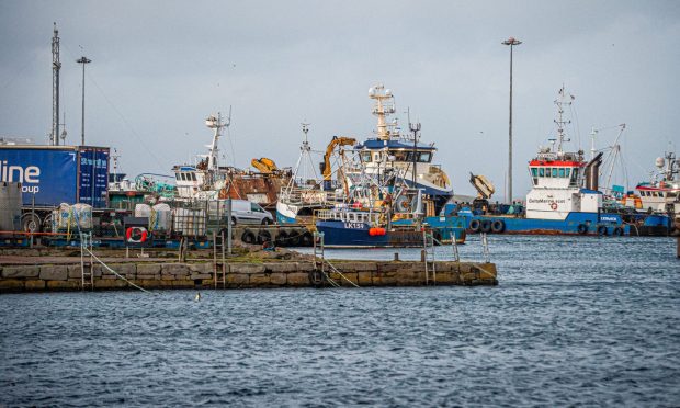 The plane was pulled into Lerwick's Harbour yesterday morning. Image: Wullie Marr/DC Thomson