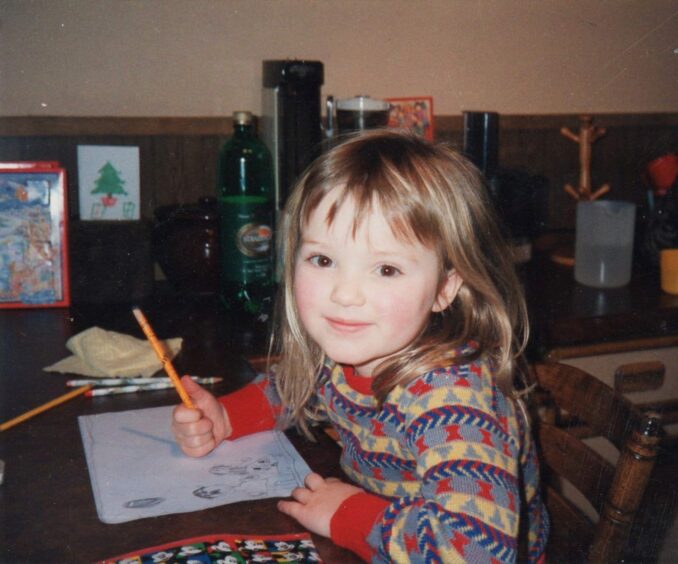 Alicia Martin as a child drawing