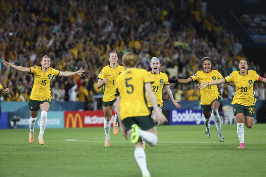 Australia players celebrate their win over France in the Women's World Cup Image: AP Photo/Tertius Pickard