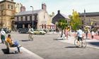 The scheme aims to shift the focus in Academy Street from driving to walking, cycling and wheeling