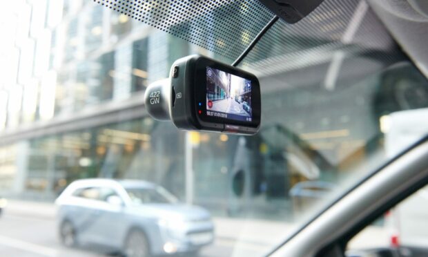 A dashcam fitted at the front of a car