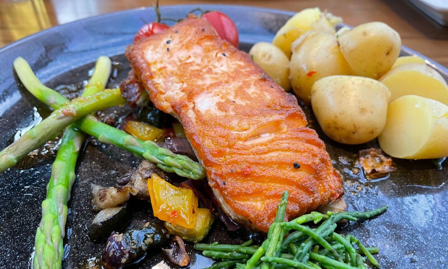 The golden-coloured salmon from Ferryhill House Hotel along with asparagus, baby potatoes, cherry tomatoes and samphire