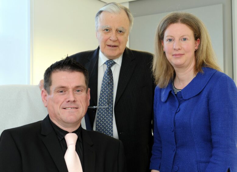 Shona Robinson with a patient of the the Peter Brunt Outpatient Clinic, James Morgan and Professor Peter Brunt himself.