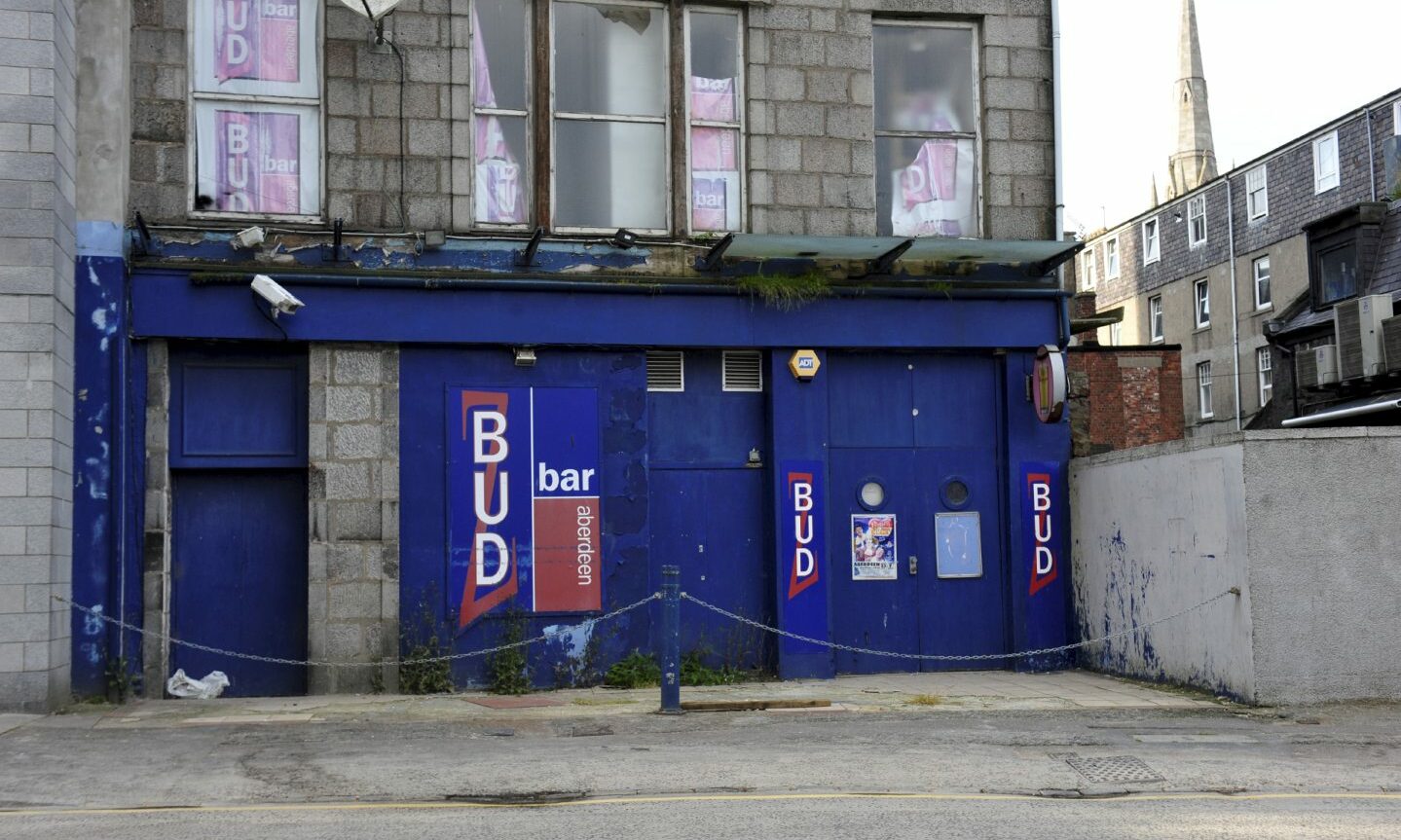 Exterior of the former Budz Bar in a state of disrepair in 2015.