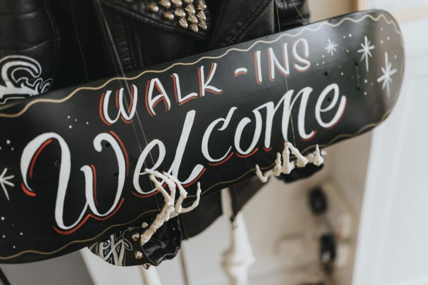 walk-ins welcome sign at Nevermind Professional Electric Tattoo 