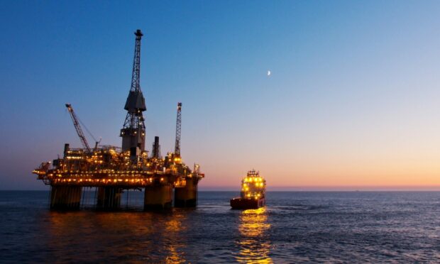 Silhouette of a floating production platform in North Sea.