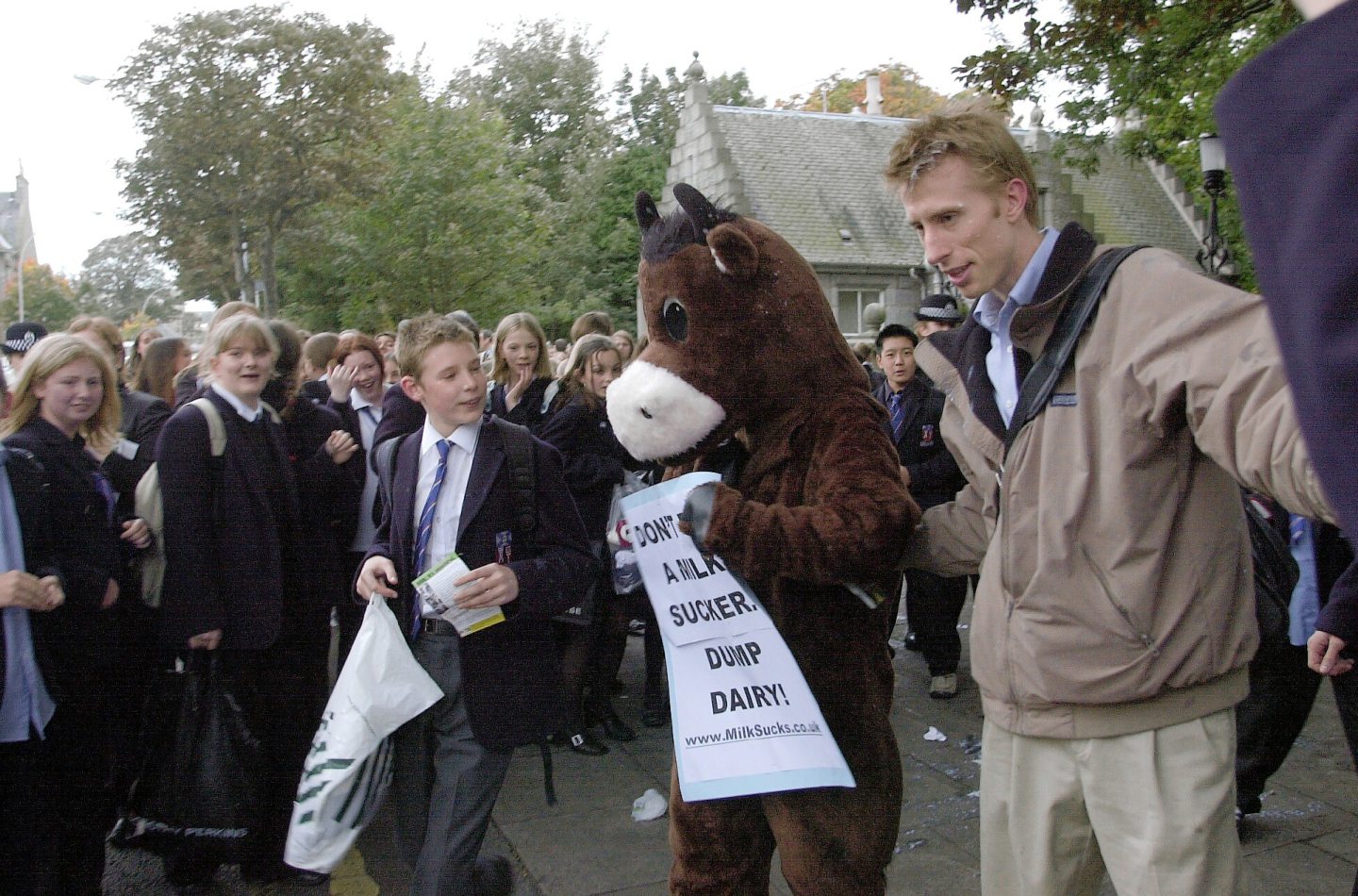 PETA 'Dump Dairy' campaign director Sean Gifford leaving Aberdeen Grammar School after being pelted with milk cartons by school children in 2002.