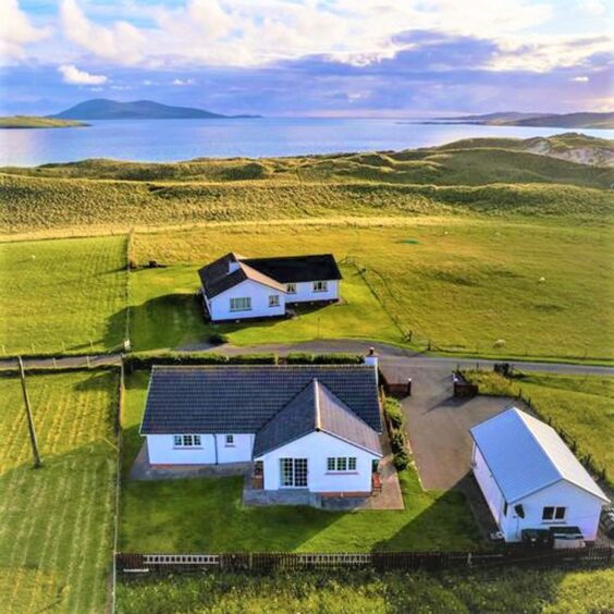 Another aerial view of the Luskentyre property with open green spaces.