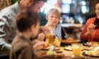 Family at table in restaurant for Aberdeen Restaurant Week.