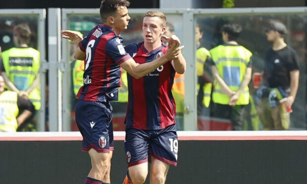 Bologna's Lewis Ferguson celebrates with teammate Nikola Moro after scoring against Napoli. Image: Shutterstock.