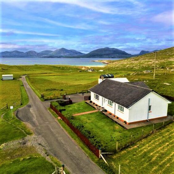 Aerial view of the house for sale in Luskentyre with beach nearby.