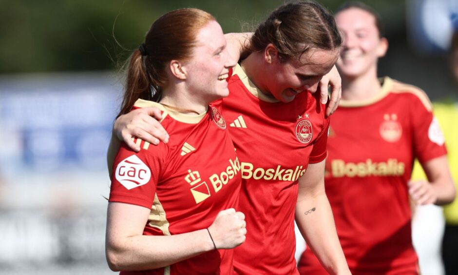 Hannah Stewart, left, and Bayley Hutchison, right celebrate after the former's goal against Hamilton Accies.
