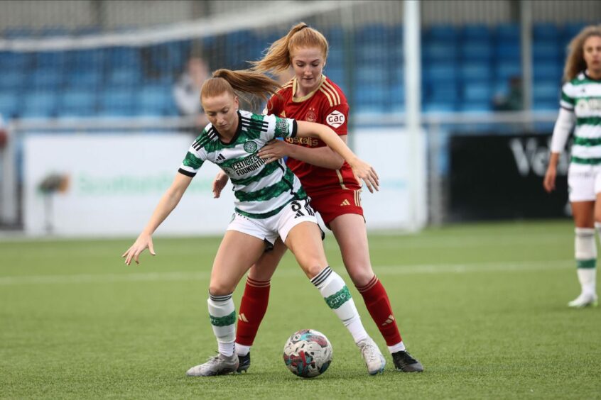 Aberdeen midfielder Eilidh Shore battles with Celtic's Jenny Smith in a SWPL match at Balmoral Stadium.