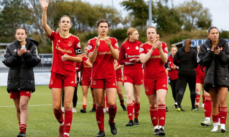 Aberdeen Women players applaud the Balmoral Stadium crowd after the SWPL match against Celtic.