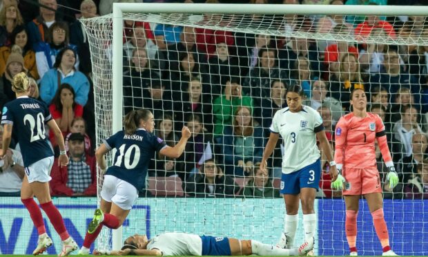 Kirsty Hanson, number 10, celebrates after scoring for Scotland in a Nations League match against England.