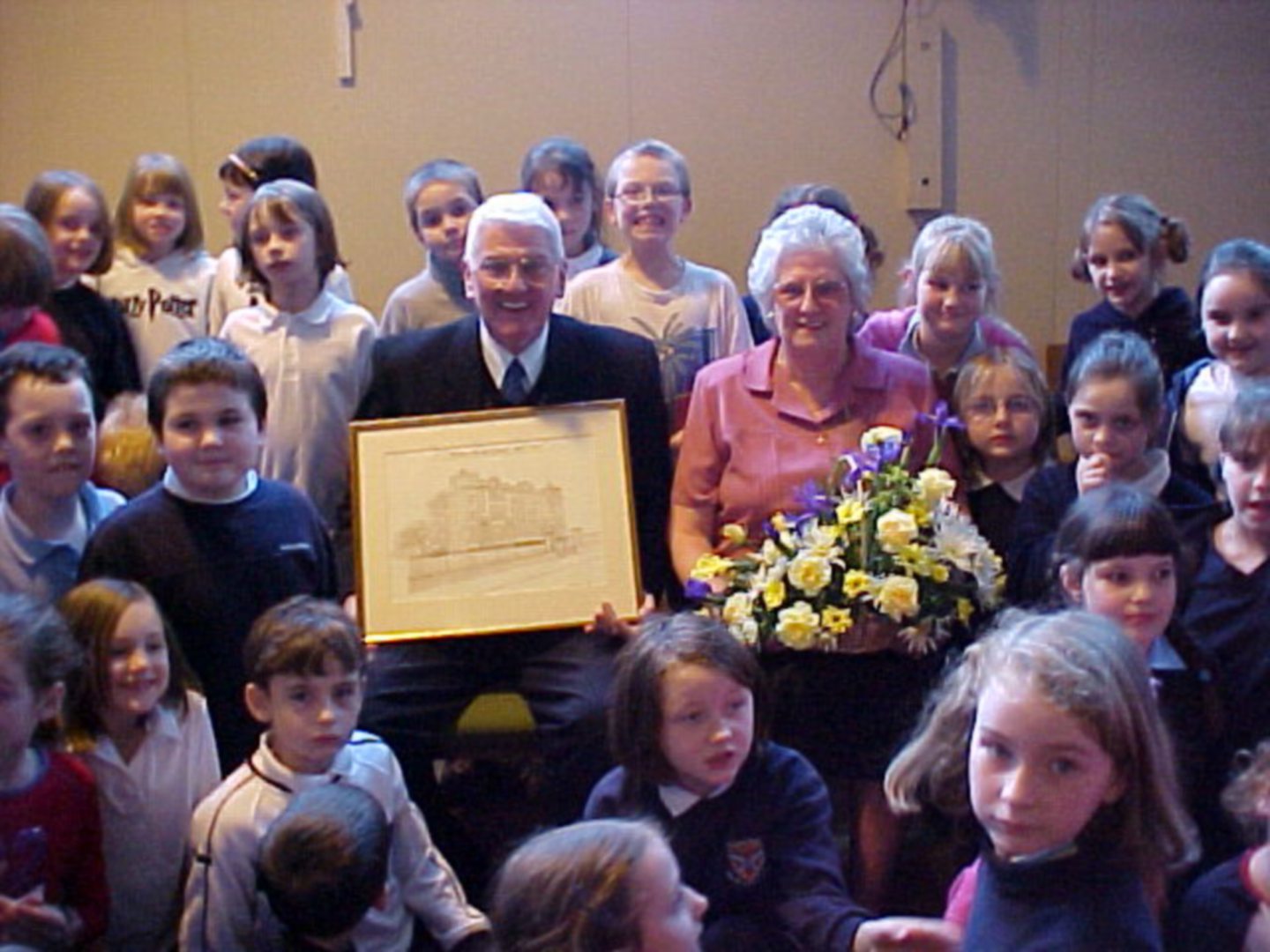  A presentation for Ernie Mair, who retired as lollipop man at Walker Road School in January 2002.