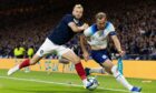 Scotland's Ryan Porteous and England's Harry Kane in action during the 150th Anniversary Heritage Match at Hampden Park, on September 12, 2023, in Glasgow, Scotland. Image: SNS.
