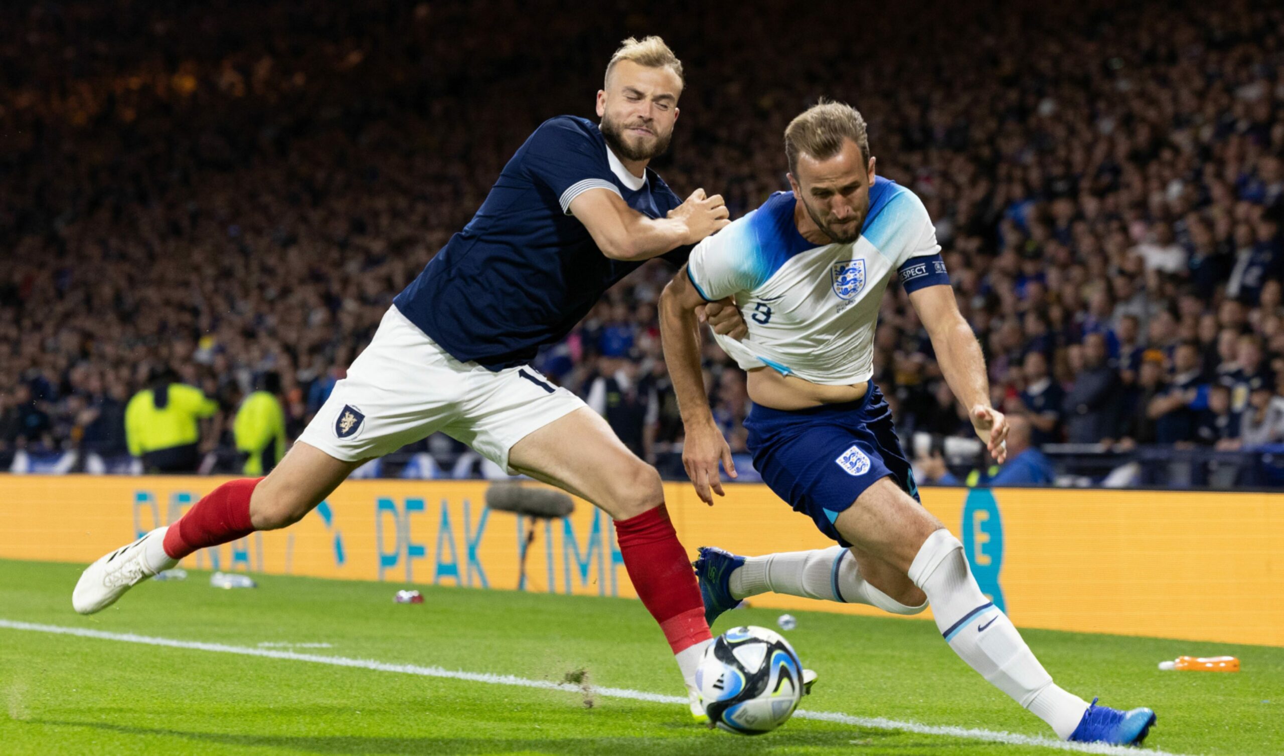 Scotland's Ryan Porteous and England's Harry Kane in action during the 150th Anniversary Heritage Match