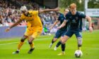 Livingston's Luiyi De Lucas (L) and Ross County's Simon Murray in action. Image: SNS.