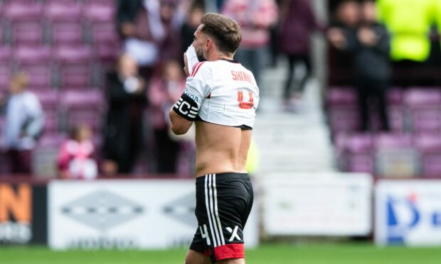 EDINBURGH, SCOTLAND - Aberdeen captain Graeme Shinnie looks dejected at full time after losing 2-0 at Hearts. Image:SNS