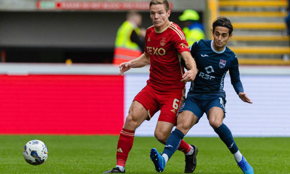 Aberdeen's Stefan Gartenmann, left, and Ross County's Yan Dhanda