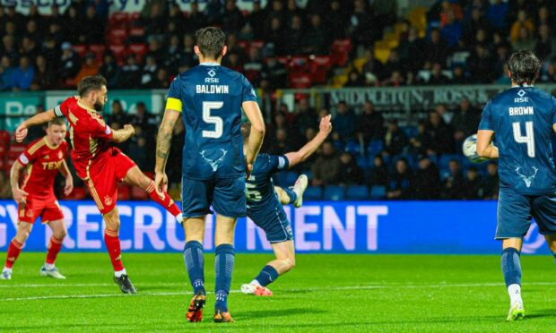 Aberdeen's Graeme Shinnie rifles home his early volley at Ross County.
Image: Ross Parker/SNS Group