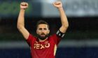 Graeme Shinnie celebrates Aberdeen's 2-1 win at Ross County in the Viaplay Cup quarter-final. Image: SNS.