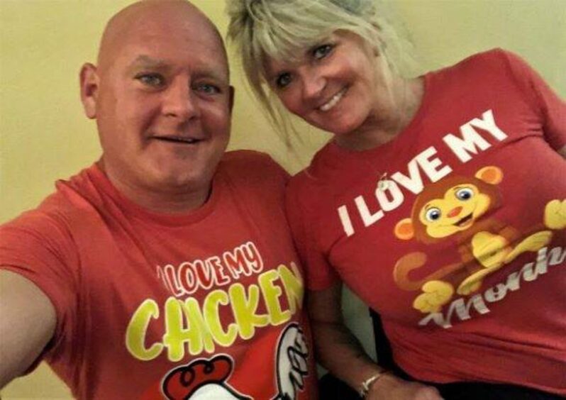 Wayne Fraser with wife Natalie Ryan-Fraser in T-shirts that read 'I love my chicken' and 'I love my monkey' respectively.