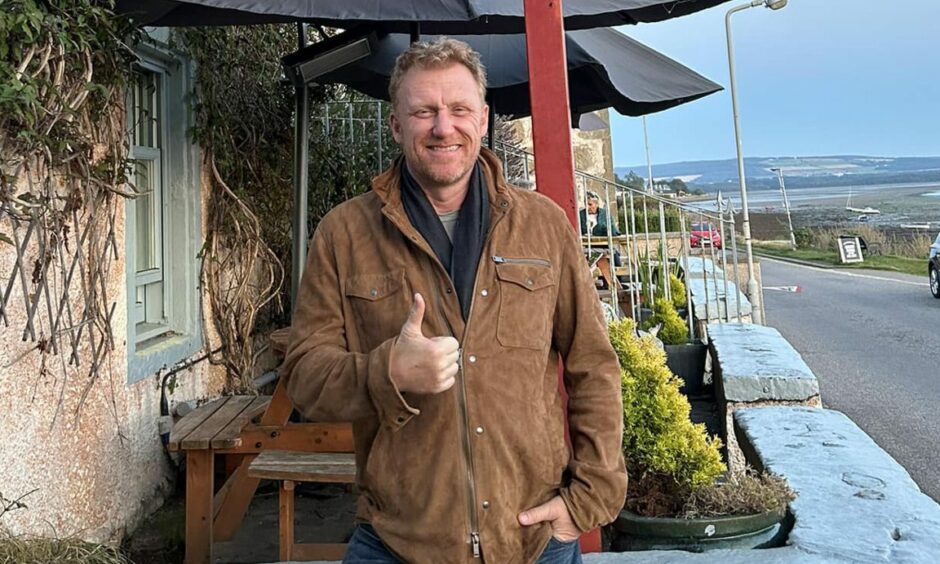 Kevin McKidd with his thumbs up outside the Kimberley Inn in Findhorn.