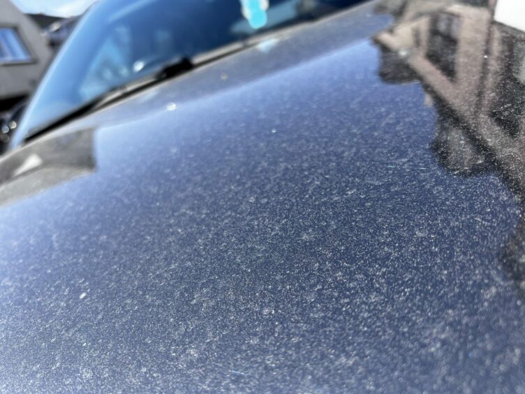 Close-up images of the car show dust all over the bonnet.