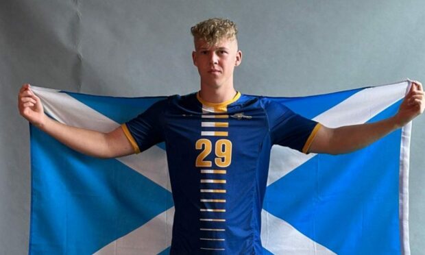 Ethan Walker with a Scotland flag.