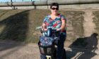 Sarah MacDougall has been using an electric wheelchair for long distances.