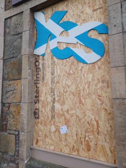 Windows on the Inverness Yes hub have had to be boarded up after the shop was targetted by vandals. Large YES signs have been placed in the windows. 