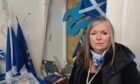 Judith Reid says attackers set out to vandalise Yes Hub in Inverness. Judith is pictured inside the shop on Huntly Street.