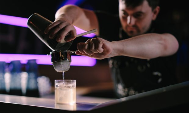 Bartender making cocktail