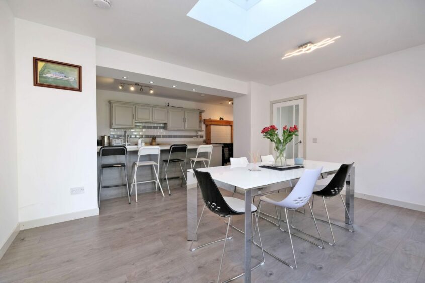 The open plan kitchen and dining area.