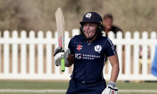 Ailsa Lister celebrates reaching her half-century for Scotland against Italy.