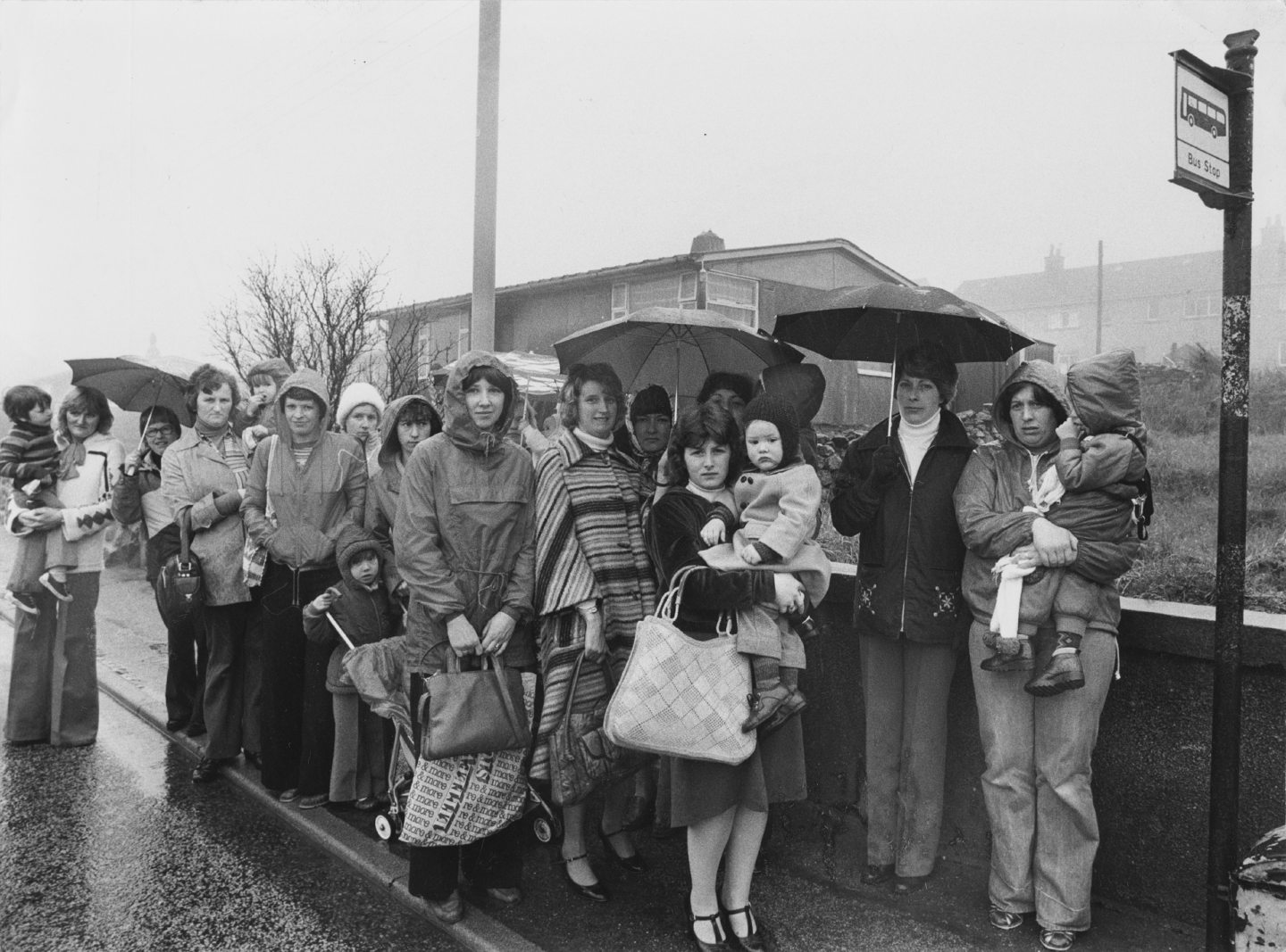Group of primary children and their parents protest against Walker Road's bus service in 1979.