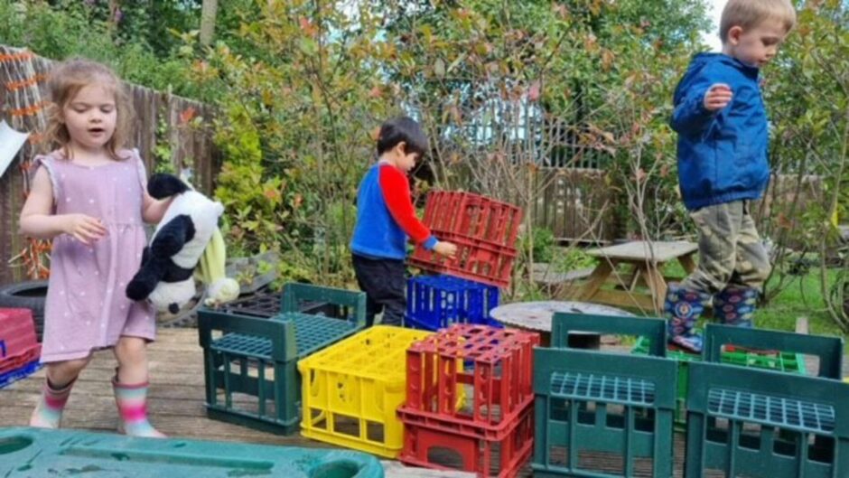 Children with crates playing outside