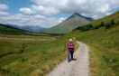 Noreen walking along the West Highland Way with Ben Dorian in the background.