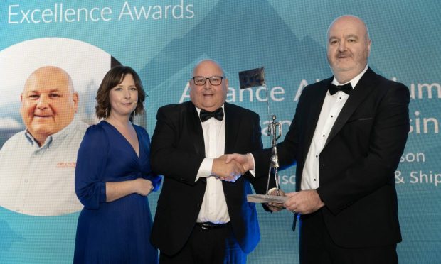 Alasdair Ferguson, centre, recieving his outstanding business leader award from Tom Uppington, managing director, Alvance Aluminium (award sponsor), with event host Nicola McAlley.