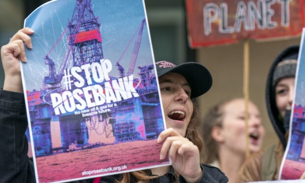 Campaigners take part in a "stop Rosebank" protest in Edinburgh, after the controversial Equinor Rosebank North Sea oilfield was given the go-ahead.