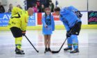 Lucy drops the ceremonial first puck as the two team captains face off. Image: Rebecca Shaw/RS Photography